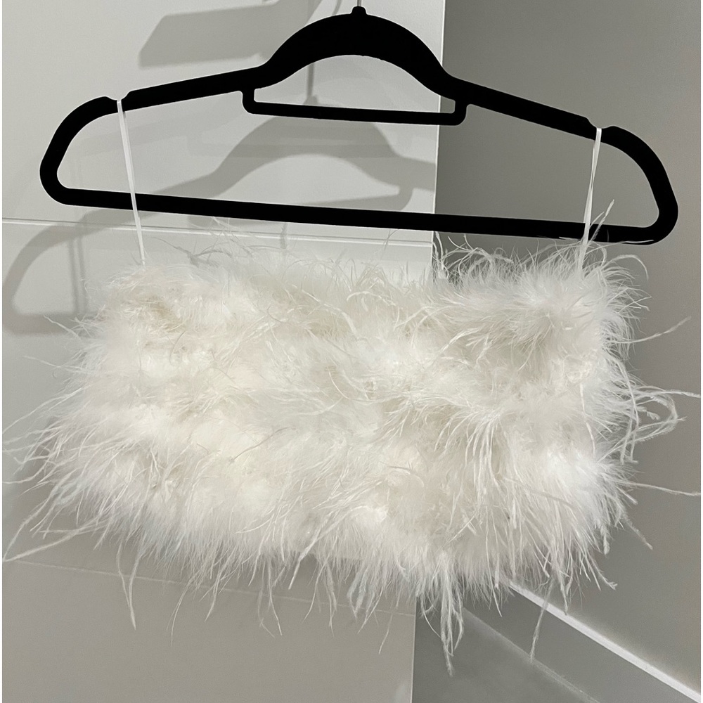 White feathered top